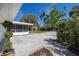 Open backyard area with mature trees, lush landscaping, and plenty of space at 1433 Park N St, St Petersburg, FL 33710