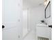 This modern bathroom features a walk-in shower with glass doors and a bright vanity with a unique mirror at 1433 Park N St, St Petersburg, FL 33710
