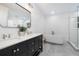 Modern bathroom featuring double vanity, soaking tub, and glass-enclosed shower at 1433 Park N St, St Petersburg, FL 33710