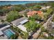Beautiful exterior view of the home highlighting its well-maintained yard, screened pool, and spacious driveway at 1433 Park N St, St Petersburg, FL 33710