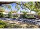 Charming single-story home featuring a well-maintained front yard and a wide driveway at 1433 Park N St, St Petersburg, FL 33710