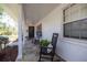 Charming front porch with slate tiles, classic rocking chairs, and a welcoming wreath at 1433 Park N St, St Petersburg, FL 33710