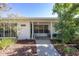 Inviting front porch with rocking chairs and a well-manicured garden at 1433 Park N St, St Petersburg, FL 33710
