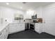 Bright kitchen features stainless steel appliances, quartz countertops, and white cabinets at 1433 Park N St, St Petersburg, FL 33710