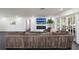 Spacious living room with a modern fireplace, TV, and comfortable sectional couch at 1433 Park N St, St Petersburg, FL 33710
