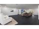 Expansive living room featuring dark hardwood floors, a fireplace, and lots of natural light at 1433 Park N St, St Petersburg, FL 33710