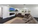 Comfortable living room with a modern fireplace, TV, and large sectional couch at 1433 Park N St, St Petersburg, FL 33710