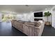 Bright living room with fireplace, TV, and large sectional couch at 1433 Park N St, St Petersburg, FL 33710