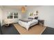 Bright main bedroom with a modern pendant light, and large windows at 1433 Park N St, St Petersburg, FL 33710