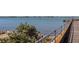 Scenic waterfront view featuring a weathered wooden pier, calm blue waters, and distant shoreline at 1433 Park N St, St Petersburg, FL 33710