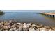 Beautiful waterfront scene showcasing a rocky shoreline, clear blue waters, and a distant pier at 1433 Park N St, St Petersburg, FL 33710