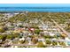 Aerial view of neighborhood with arrow pointing to the home and blue ocean in the background at 1521 San Helen Dr, Dunedin, FL 34698