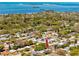 Enjoy this lovely aerial view of this property highlighting its lush backyard at 1521 San Helen Dr, Dunedin, FL 34698