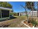 Back yard featuring garden beds, privacy fencing, and shed along the side of the home at 1521 San Helen Dr, Dunedin, FL 34698