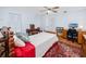 Bedroom featuring a work space, white walls, and a patterned area rug at 1521 San Helen Dr, Dunedin, FL 34698