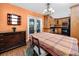 Dining room showcasing hard wood floors, chandelier lighting, and an adjacent kitchen at 1521 San Helen Dr, Dunedin, FL 34698