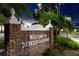 The welcome sign to Dunedin Causeway, featuring a brick structure and lush landscaping at 1521 San Helen Dr, Dunedin, FL 34698