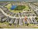 Scenic aerial view of home in a golf community with a pond at 1647 Emerald Dunes Dr, Sun City Center, FL 33573