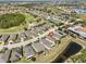 Aerial view of neighborhood with pond and lake at 1647 Emerald Dunes Dr, Sun City Center, FL 33573