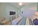 Inviting bedroom with modern furniture, ceiling fan, and neutral-toned walls at 1647 Emerald Dunes Dr, Sun City Center, FL 33573