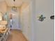 Inviting home entryway featuring neutral tones, a charming light fixture and decor at 1647 Emerald Dunes Dr, Sun City Center, FL 33573