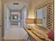 Neutral hallway features archways and a view into the living room at 1647 Emerald Dunes Dr, Sun City Center, FL 33573