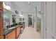 Spacious bathroom with double sinks, granite countertops, mirrors and a walk-in shower with detailed tile work at 1647 Emerald Dunes Dr, Sun City Center, FL 33573