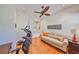 Office area with hardwood floors, ceiling fan, home gym and comfortable seating at 1647 Emerald Dunes Dr, Sun City Center, FL 33573