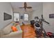 Office features hardwood floors, a ceiling fan, and ample natural light, great for a home gym at 1647 Emerald Dunes Dr, Sun City Center, FL 33573