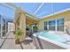 Covered patio with hot tub and plenty of space for entertaining or relaxing at 1647 Emerald Dunes Dr, Sun City Center, FL 33573