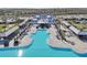 Stunning aerial view of the resort style pool, cabanas, and luxurious amenities at 16646 Maude Dr, Wimauma, FL 33598