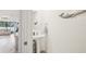 Powder room featuring pedestal sink, coastal accents, and bright lighting at 16646 Maude Dr, Wimauma, FL 33598