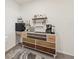 Coffee bar area features custom cabinet and multiple coffee makers at 16646 Maude Dr, Wimauma, FL 33598