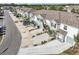 Exterior showcases a row of townhomes, each with garages and well-maintained landscaping at 16646 Maude Dr, Wimauma, FL 33598