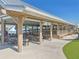 Enjoy outdoor dining with covered seating near the turquoise lagoon, with views of the community at 16646 Maude Dr, Wimauma, FL 33598