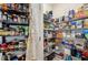 Organized pantry with ample shelving for storing various food items and household goods at 16646 Maude Dr, Wimauma, FL 33598
