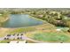 Aerial view of driving range and community lake for leisure activities at 18152 Portside St, Tampa, FL 33647