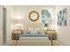 Serene bedroom featuring a comfortable bed with decorative pillows, a woven rug, and stylish bedside tables at 18453 Serene Lake Loop, Lutz, FL 33548