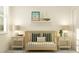 Cozy Bedroom featuring a wooden crib with decorative pillows and a nautical theme at 18453 Serene Lake Loop, Lutz, FL 33548