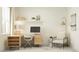 Bright home office with a wooden desk, comfortable chair, and ample natural light from the window at 18453 Serene Lake Loop, Lutz, FL 33548