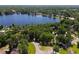 Beautiful aerial view of lakefront community surrounded by lush trees at 18846 Tracer Dr, Lutz, FL 33549