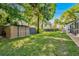 Backyard features a storage shed, providing convenient storage solutions for your outdoor equipment and tools at 18846 Tracer Dr, Lutz, FL 33549