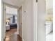 Hallway leading to the bedroom and bathroom with hardwood floors at 18846 Tracer Dr, Lutz, FL 33549