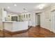 Modern kitchen with a white cabinets, stainless steel appliances, and a spacious layout for cooking at 18846 Tracer Dr, Lutz, FL 33549