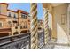 Balcony view showcasing architecture with wrought iron railings and view of adjacent residences at 254 Seagate Ct, Dunedin, FL 34698