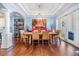Formal dining room boasts tray ceilings, hardwood floors, art niche and stylish light fixture at 254 Seagate Ct, Dunedin, FL 34698