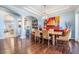 Bright dining room features hardwood floors, open floorplan and a view into the kitchen at 254 Seagate Ct, Dunedin, FL 34698