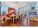Elegant dining room with a fireplace, modern lighting, and beautiful decor at 254 Seagate Ct, Dunedin, FL 34698