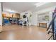 Neat and tidy garage featuring an epoxy floor, abundant natural light, and ample storage solutions at 254 Seagate Ct, Dunedin, FL 34698