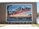 Colorful mural featuring a 'Greetings from Dunedin, Florida' theme with water view at 254 Seagate Ct, Dunedin, FL 34698